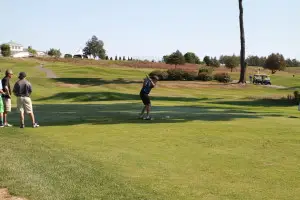 Swinging for a hole in one at the 2015 Classic.